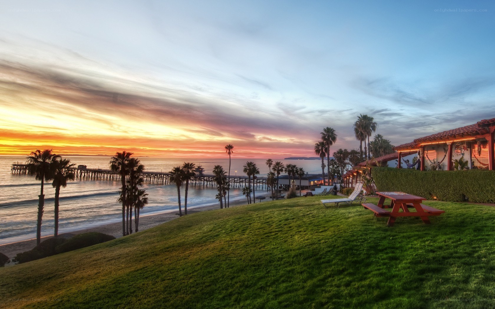 sunset at the beach with pier