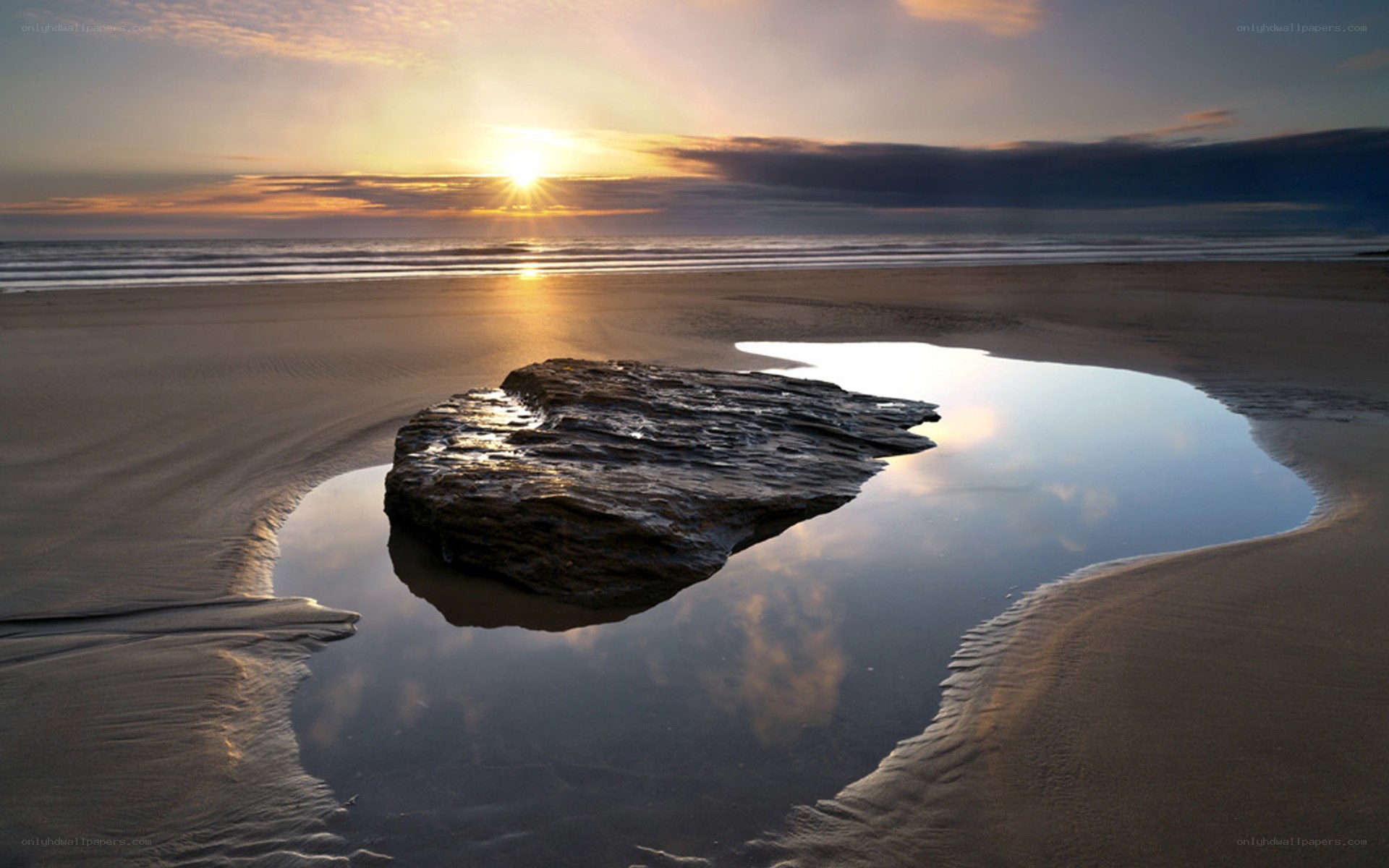Sunset at the beach with rock