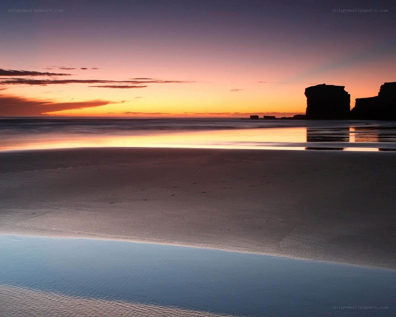 Sunset at the beach with rock formations