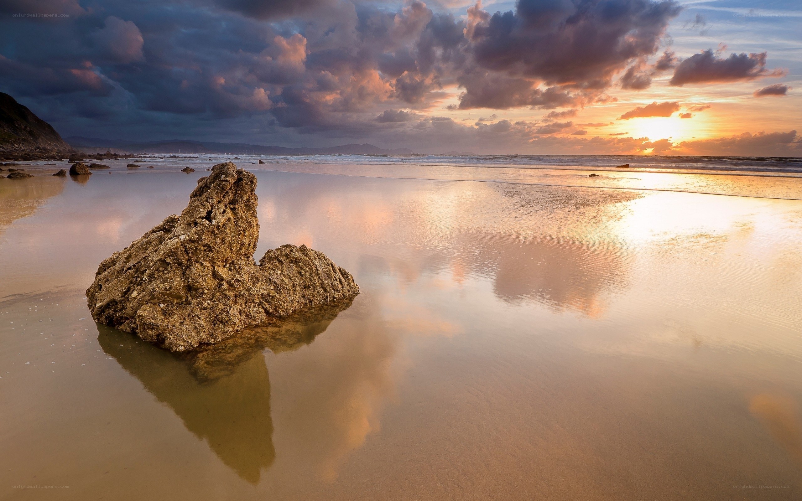 Sunset at the beach with rock