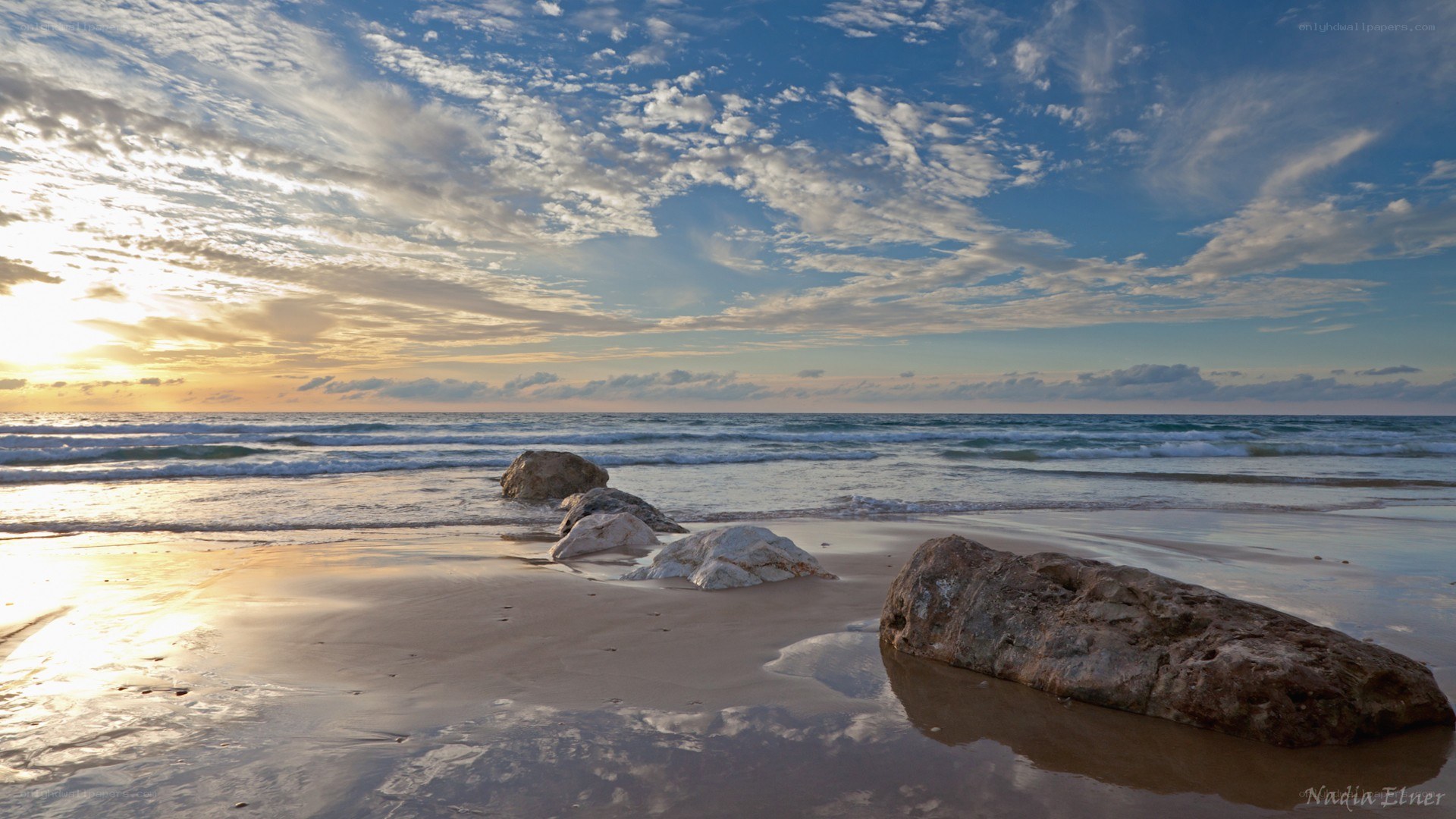 Sunset at the beach with rocks