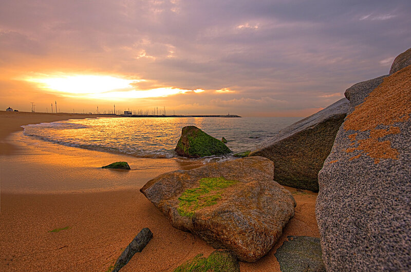 Sunset at the beach with rocks