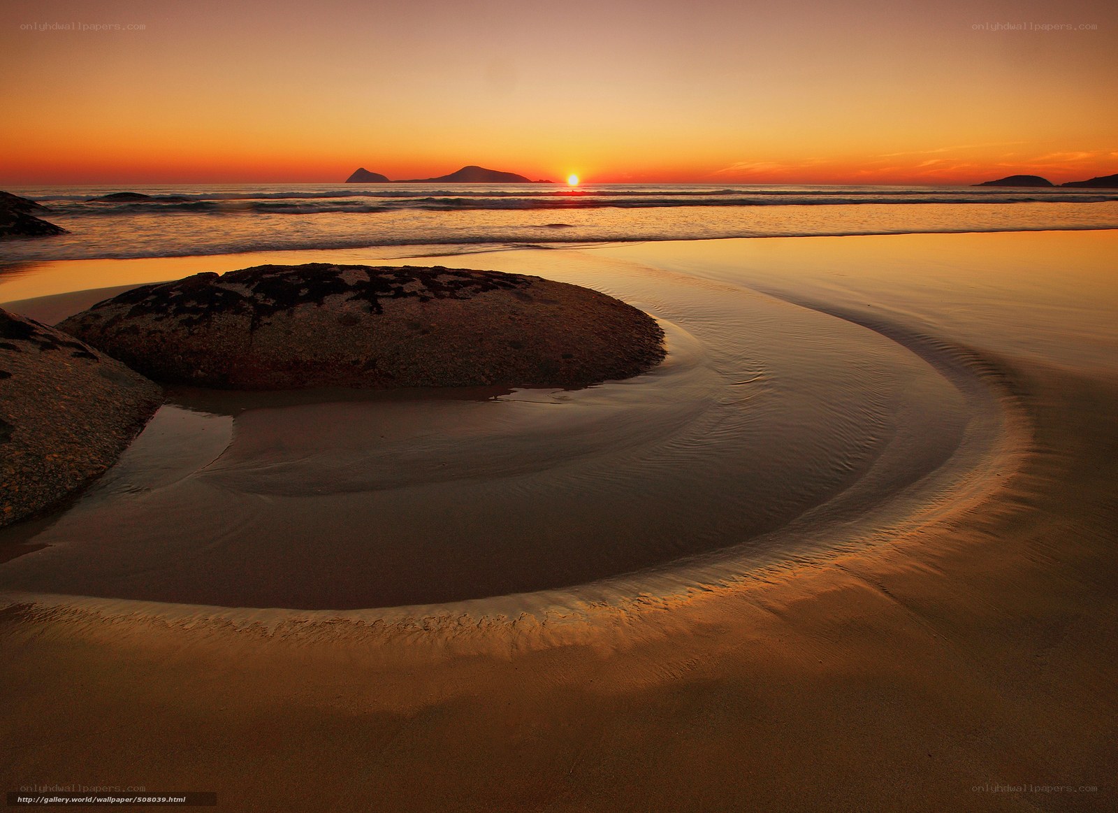 Sunset at the beach with rocks