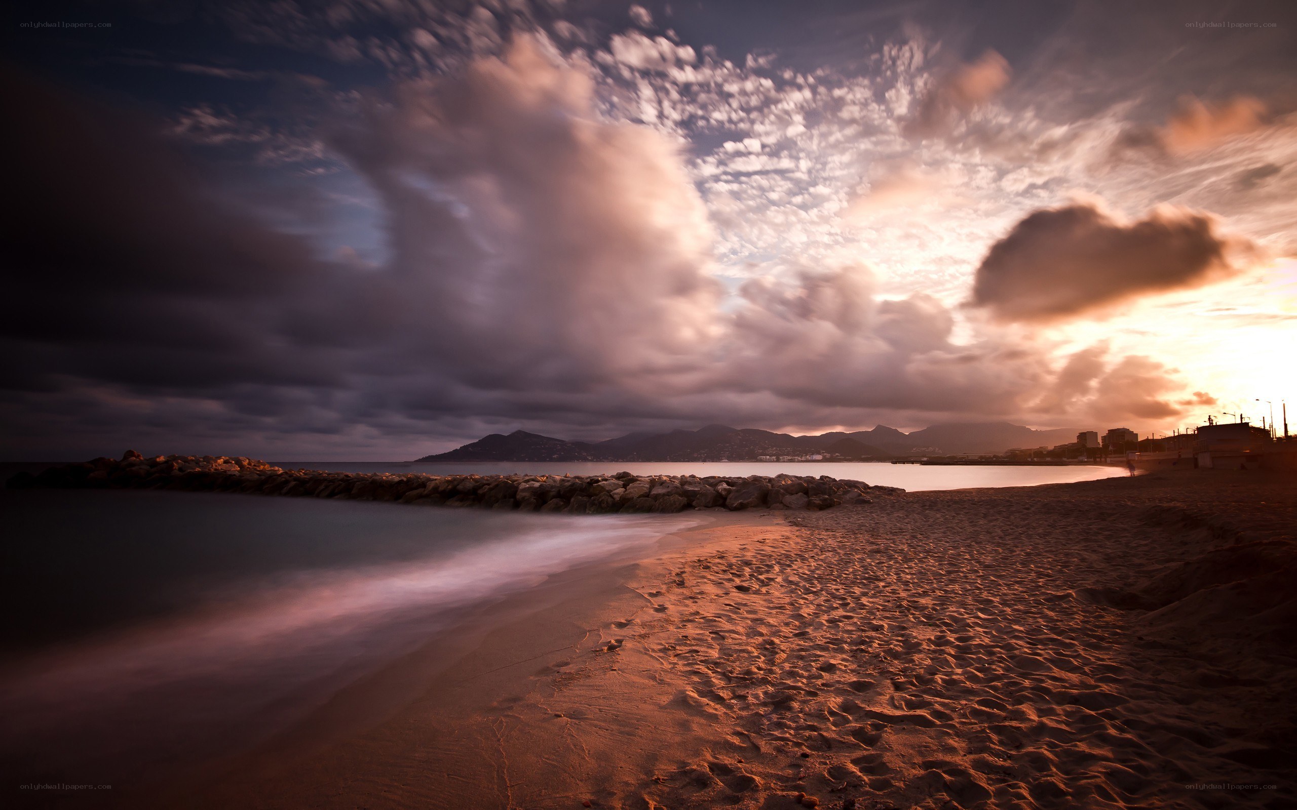 Sunset at the beach with rocks