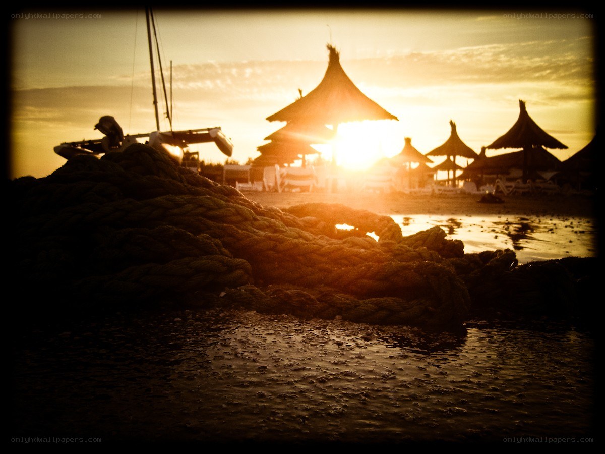 Sunset at the beach with ropes