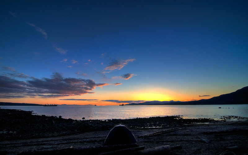 sunset at the beach with tent