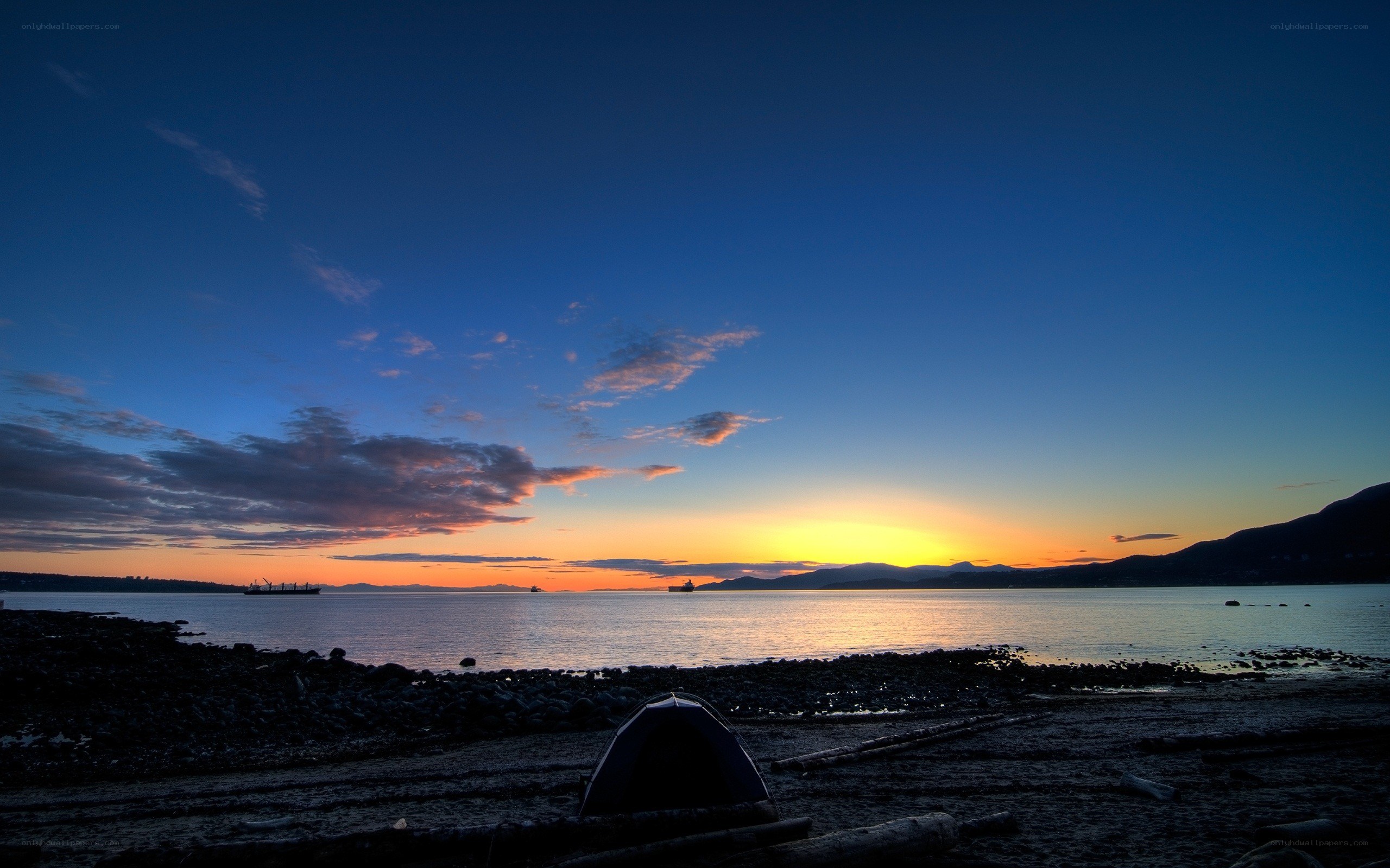 sunset at the beach with tent