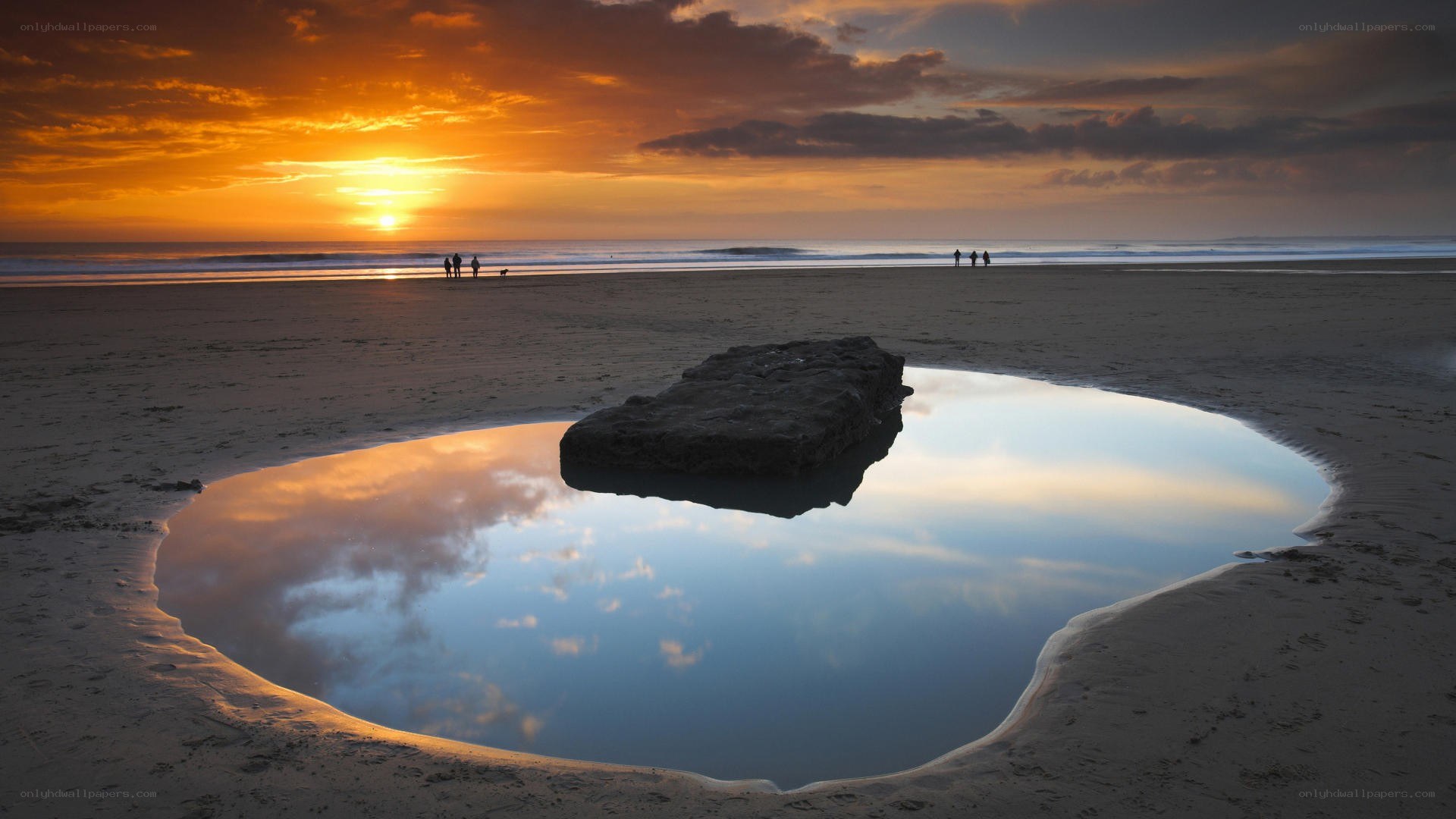 Sunset at the beach with tide pool
