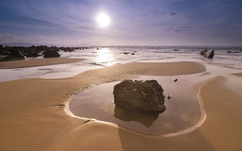 Sunset at the beach with tide pool
