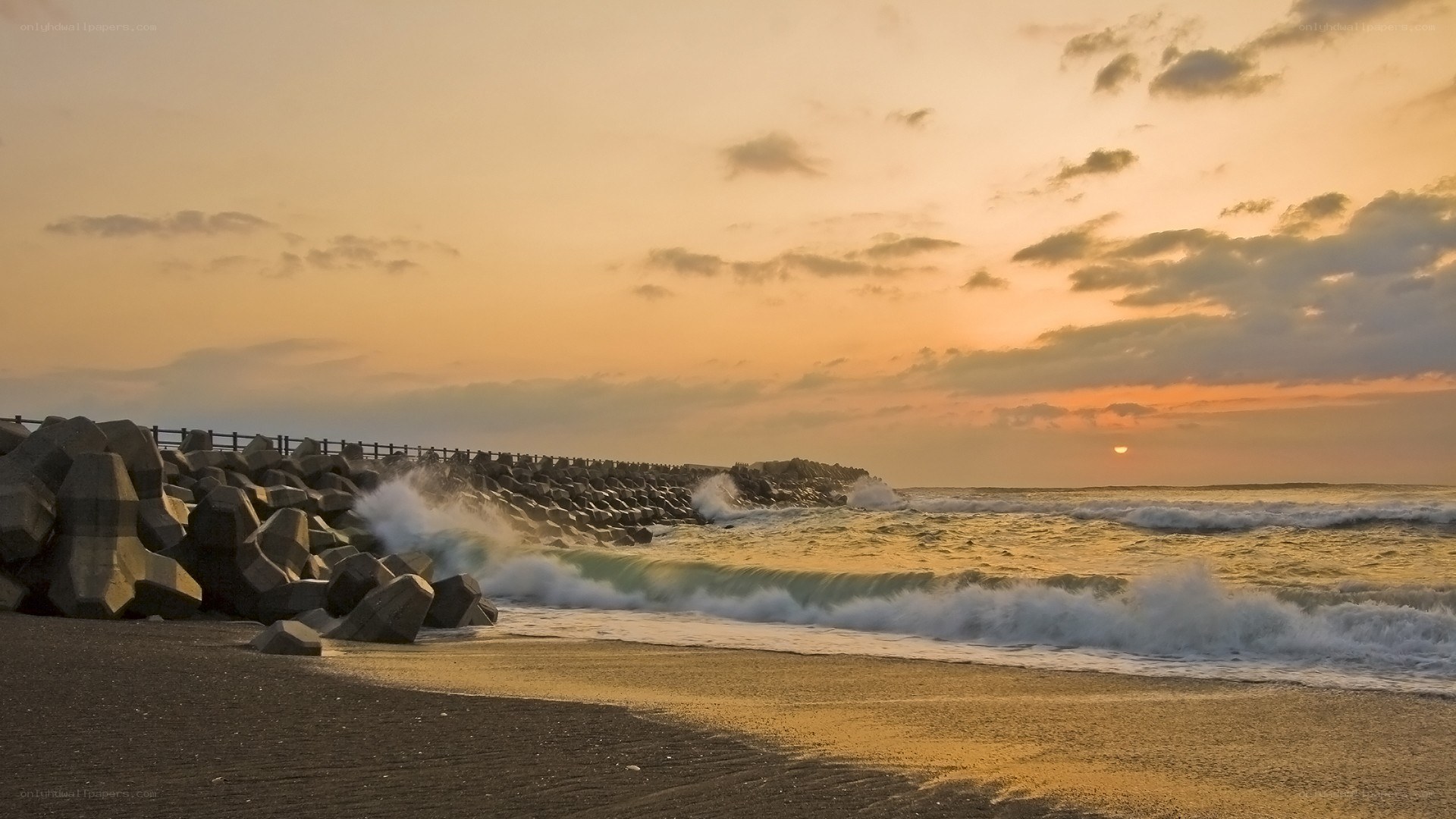 Sunset at the coastal breakwater