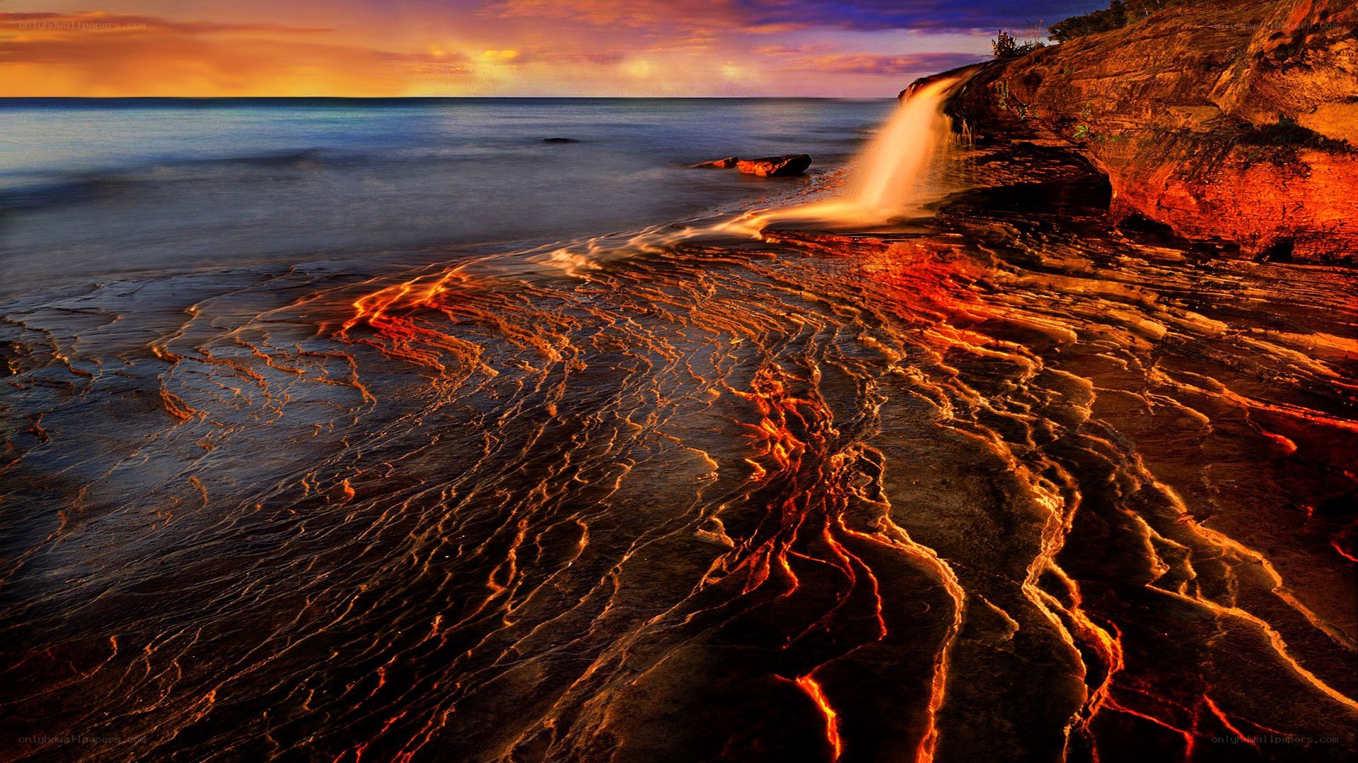 Sunset at the coastal waterfall