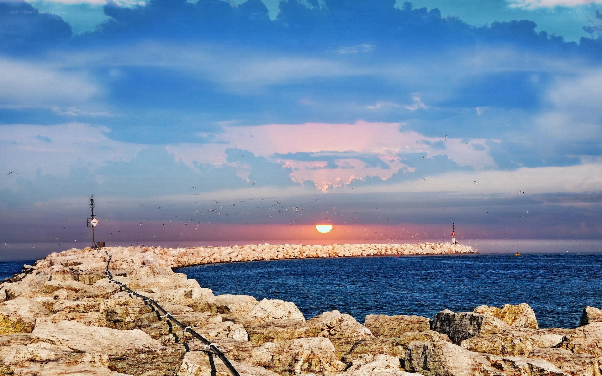Sunset at the harbor breakwater