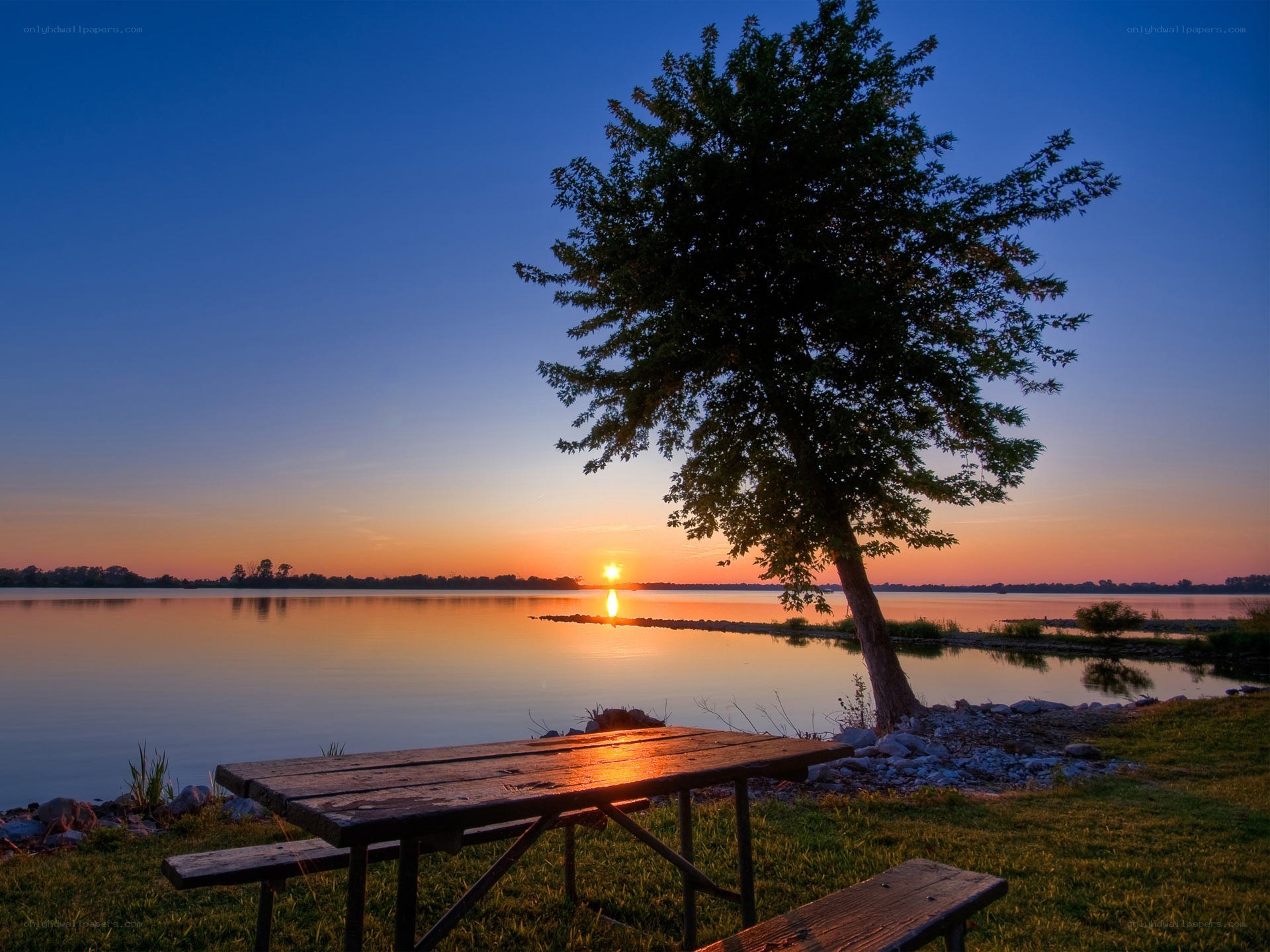 Sunset at the lakeside picnic table