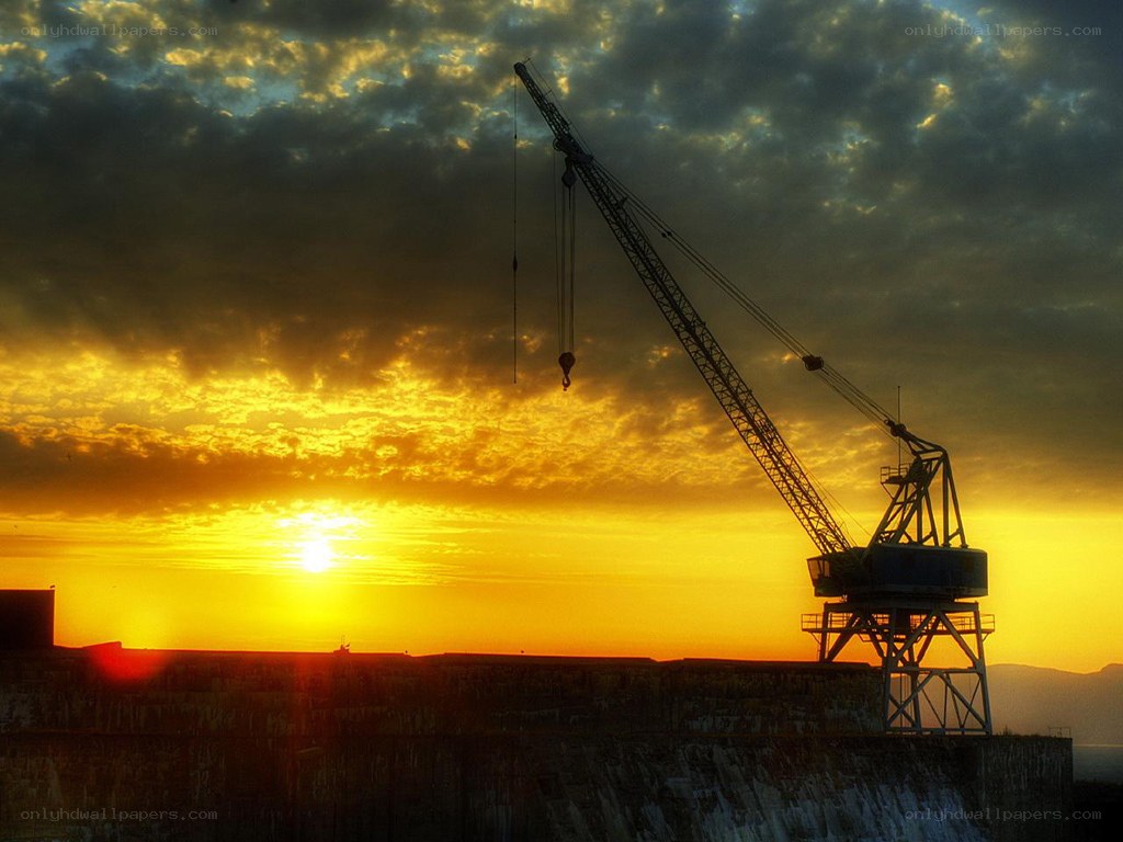 Sunset at the port with crane