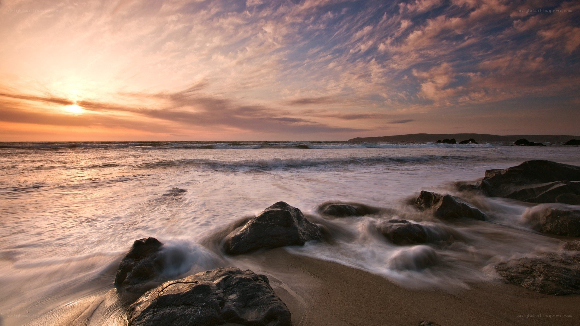 Sunset at the rocky beach