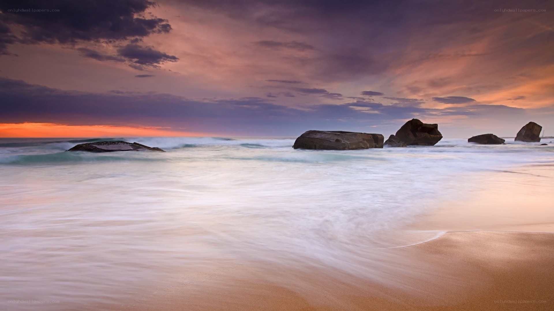 Sunset at the rocky beach
