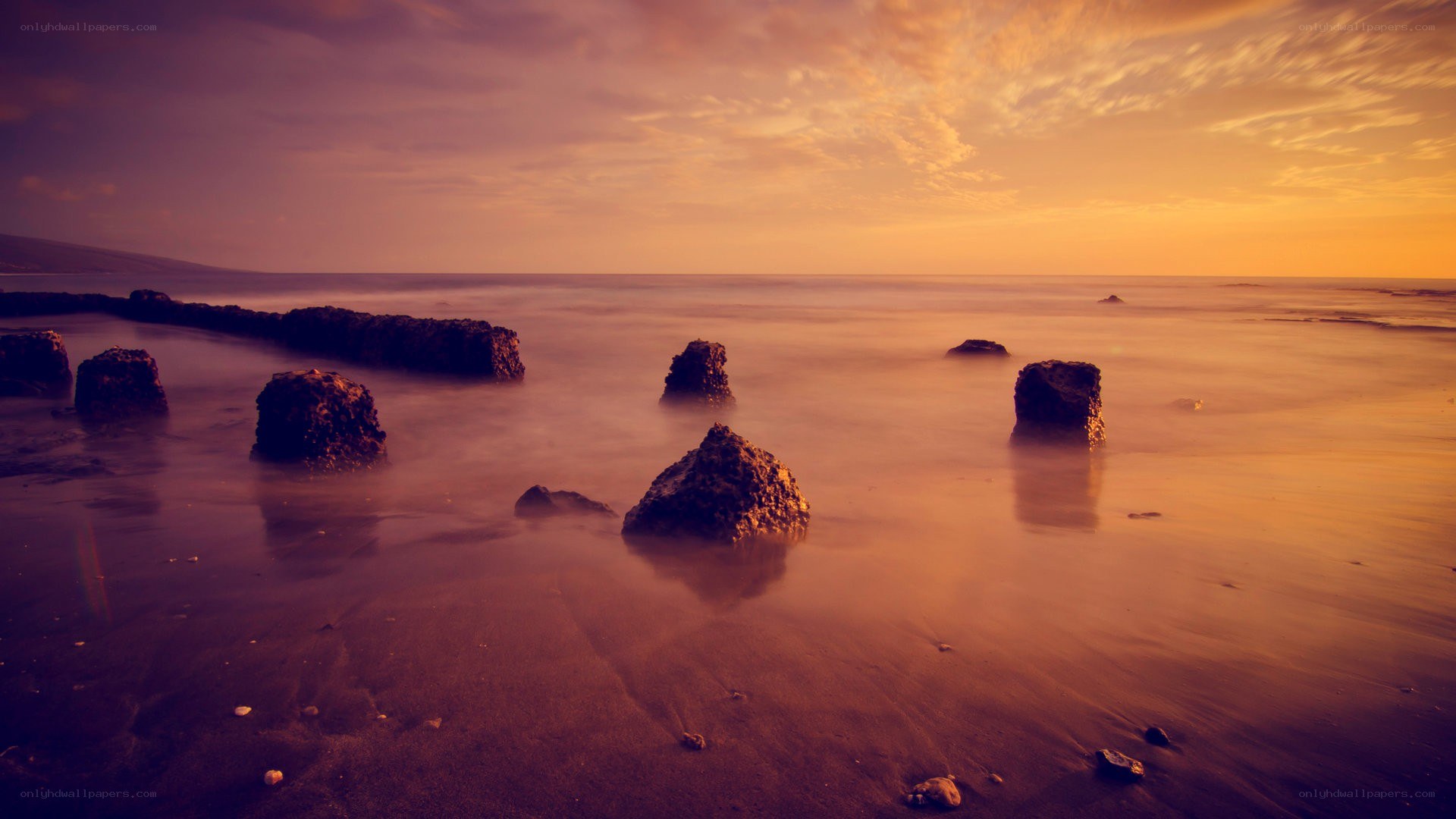 Sunset at the rocky beach