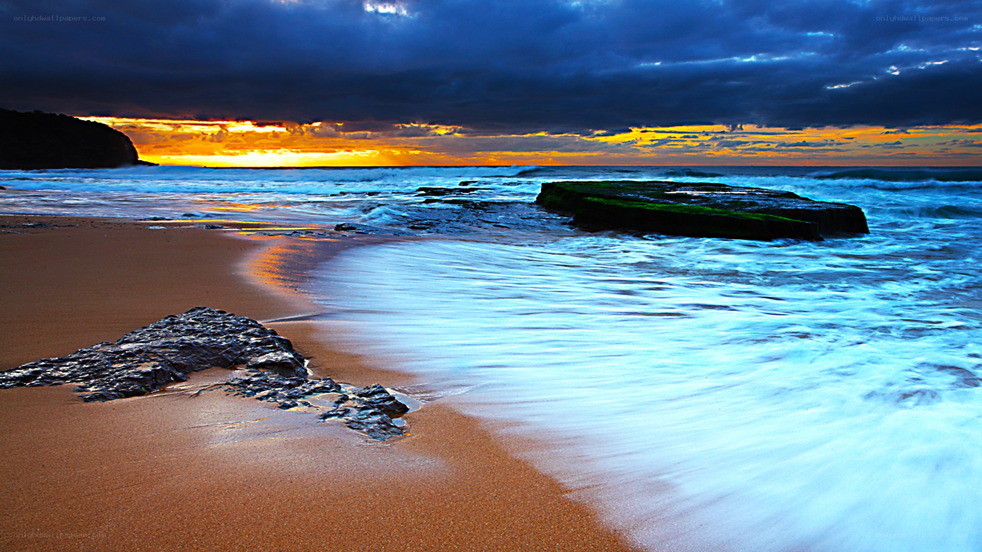 Sunset at the rocky beach
