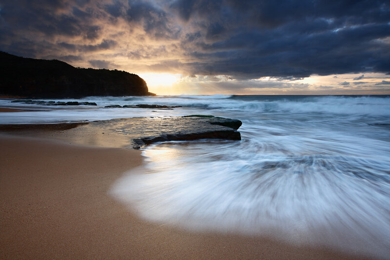 Sunset at the rocky beach