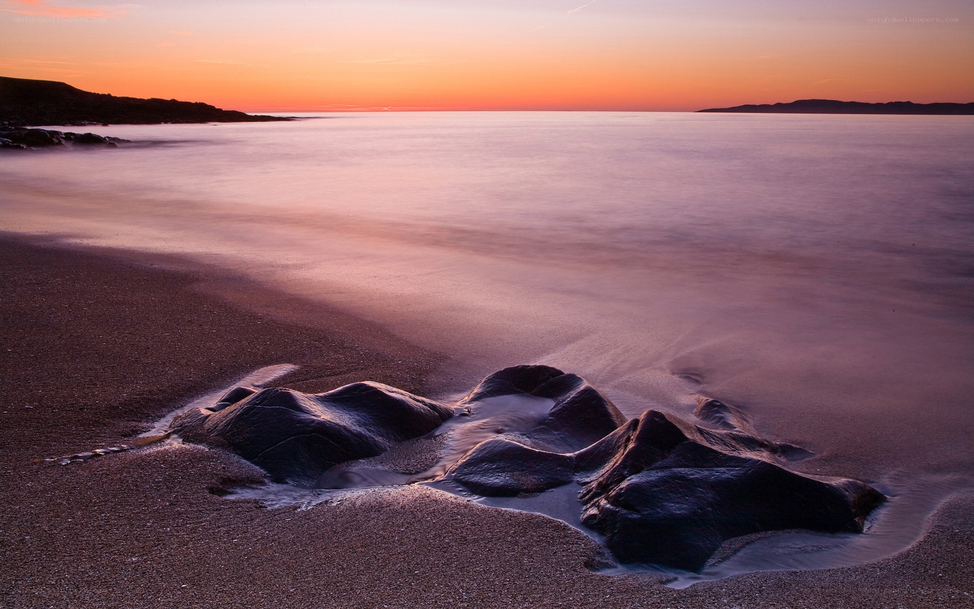Sunset at the rocky beach