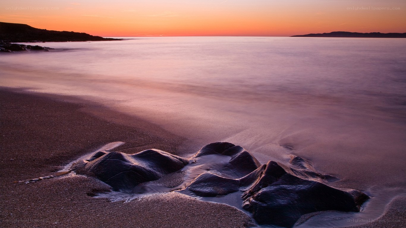 Sunset at the rocky beach