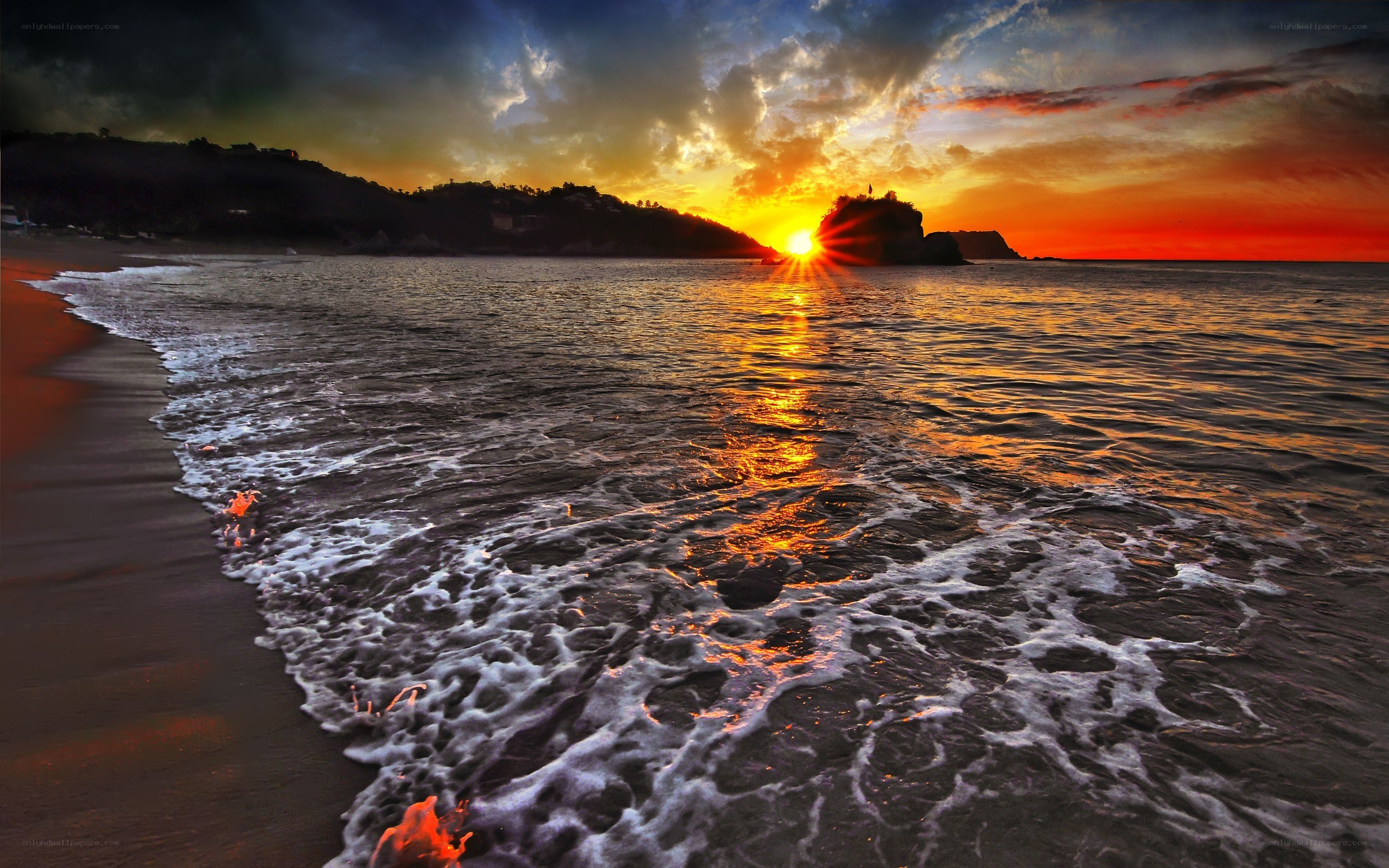 Sunset at the rocky beach