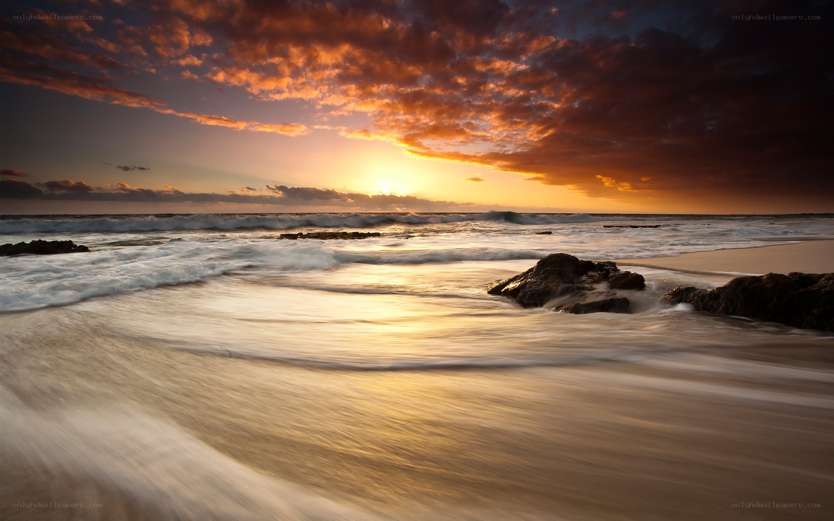 Sunset at the rocky beach