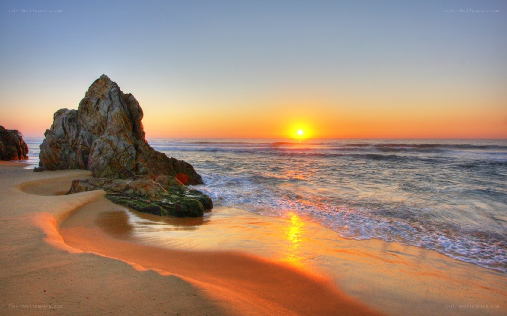 Sunset at the rocky beach