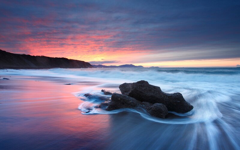 Sunset at the rocky beach