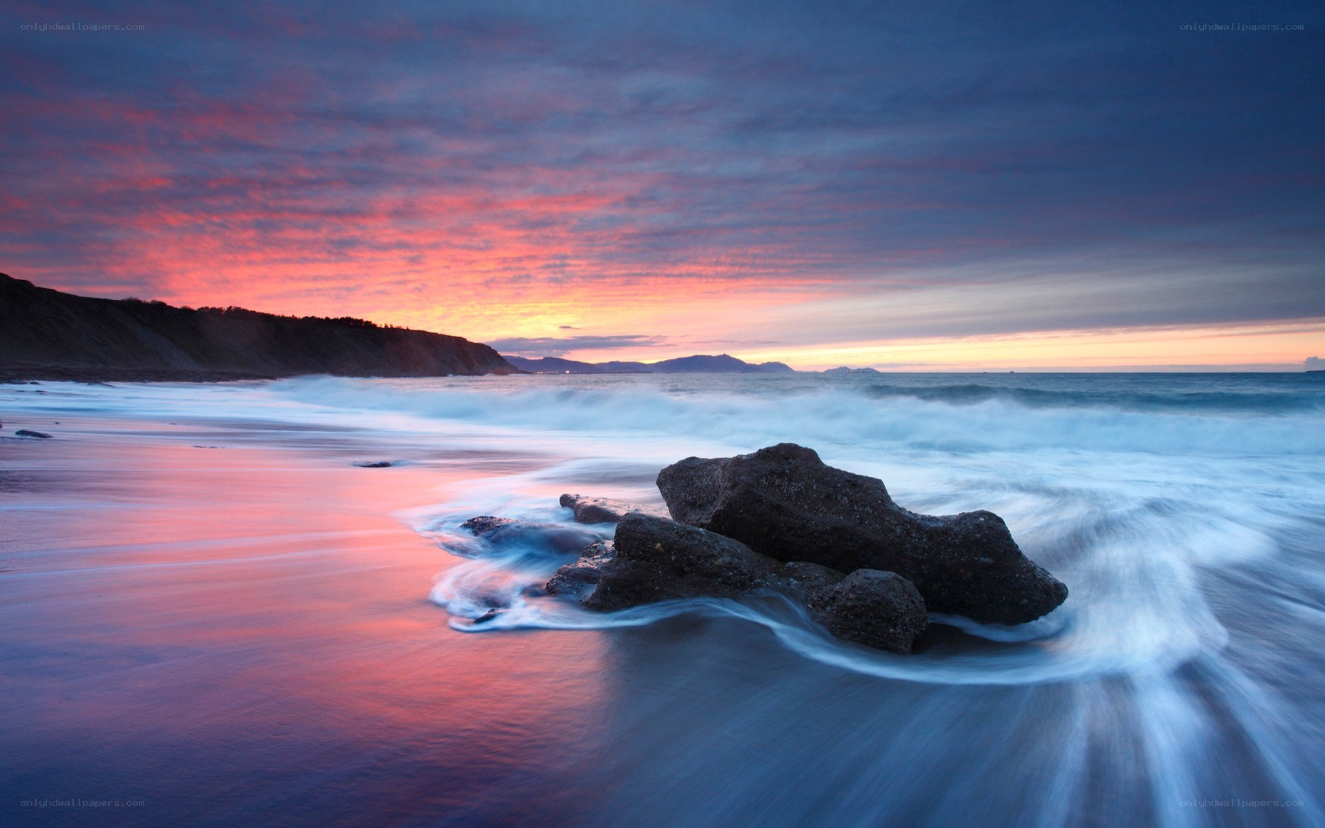 Sunset at the rocky beach