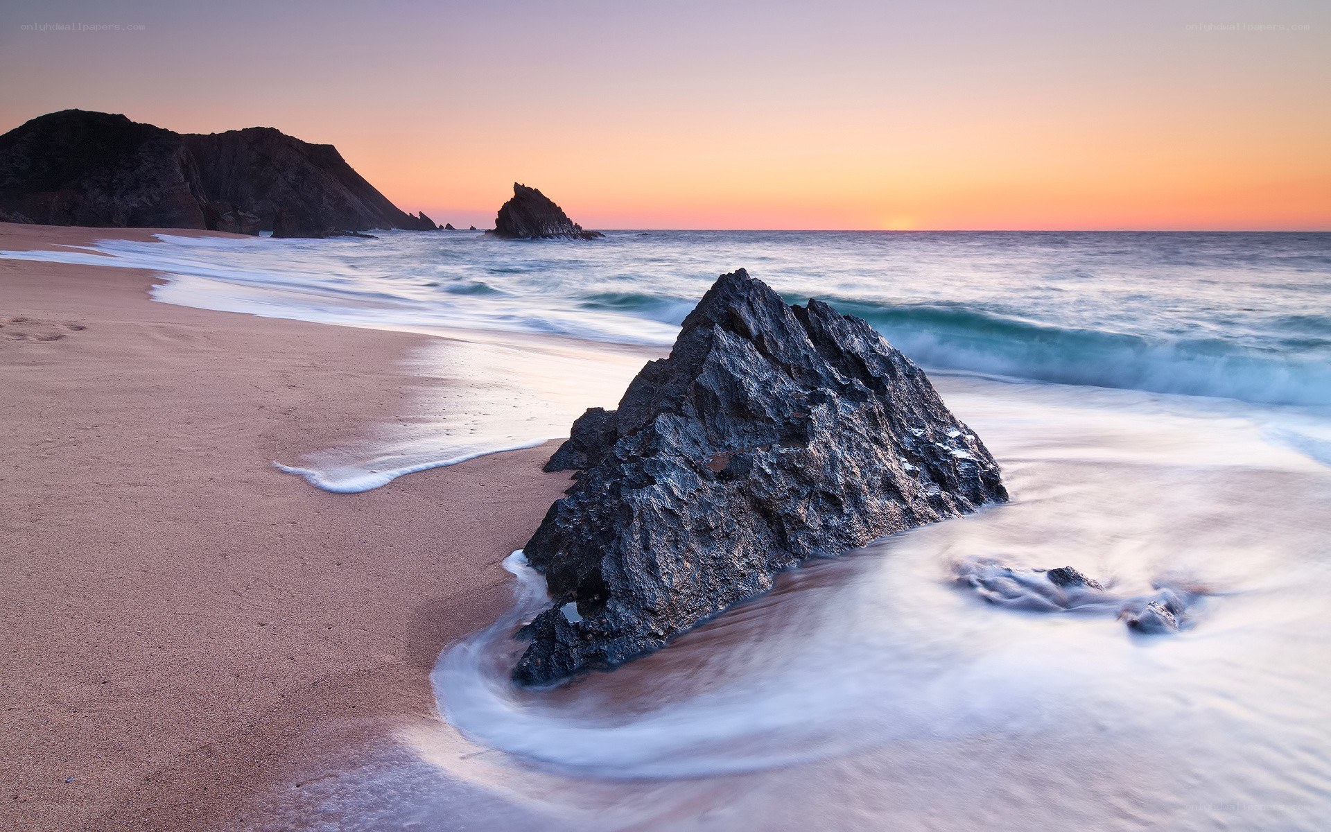 Sunset at the rocky beach