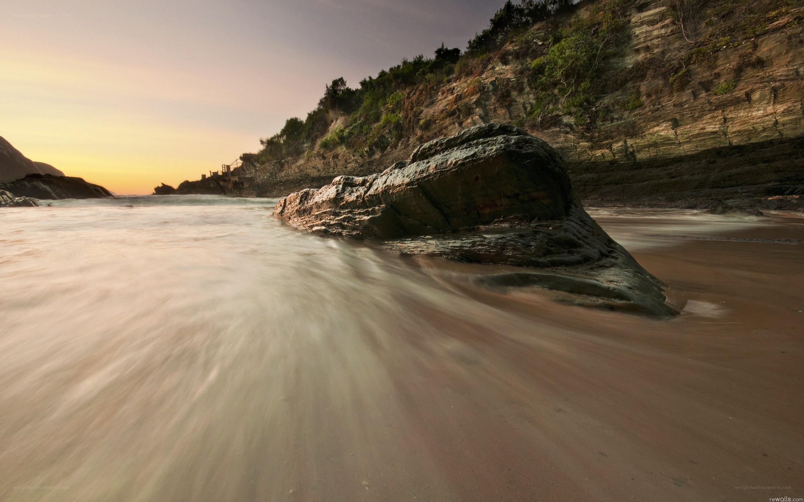Sunset at the rocky beach