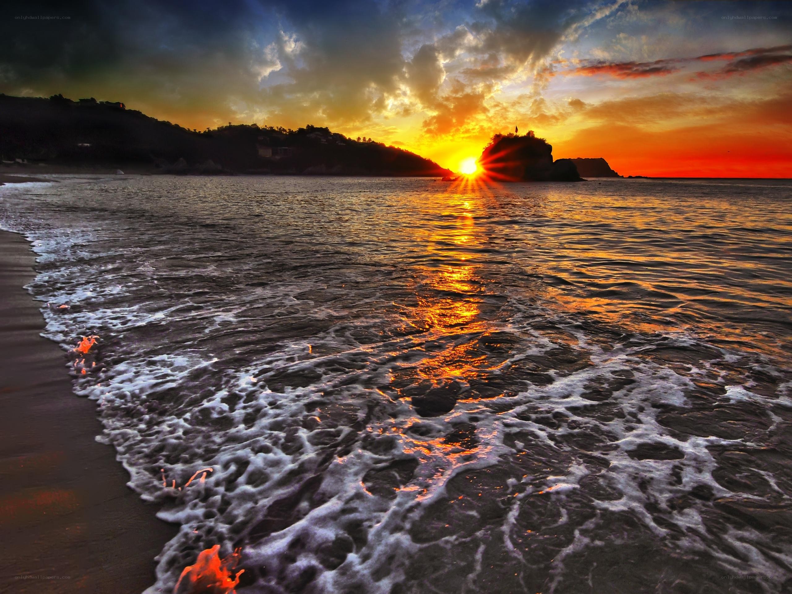 Sunset at the rocky beach