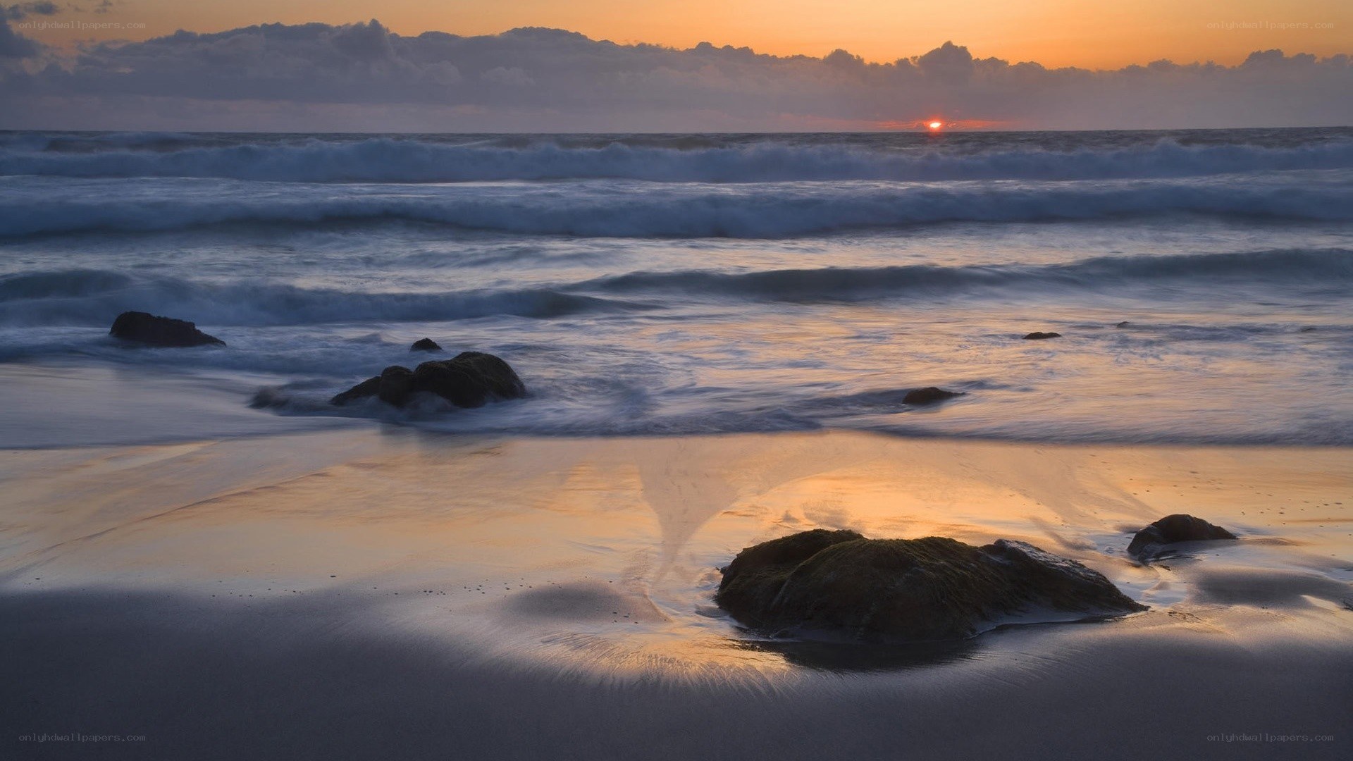 Sunset at the rocky beach