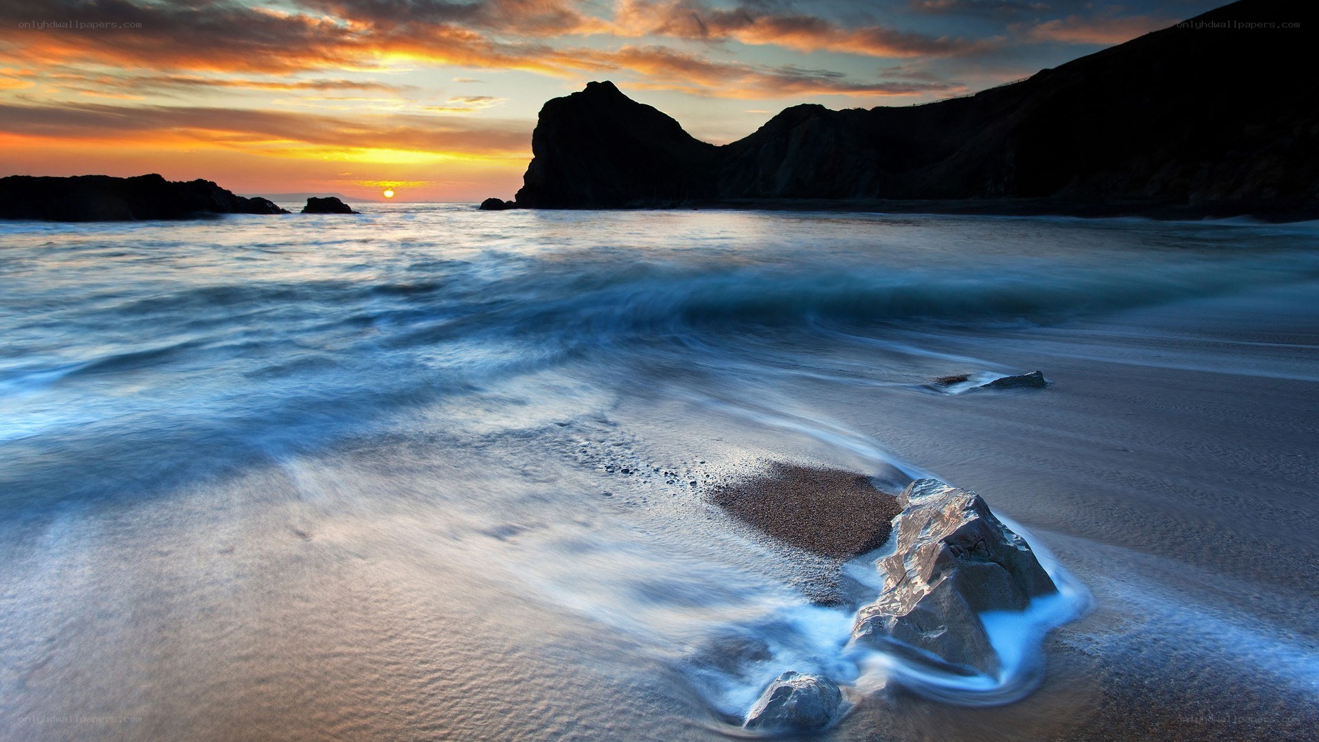 Sunset at the rocky beach