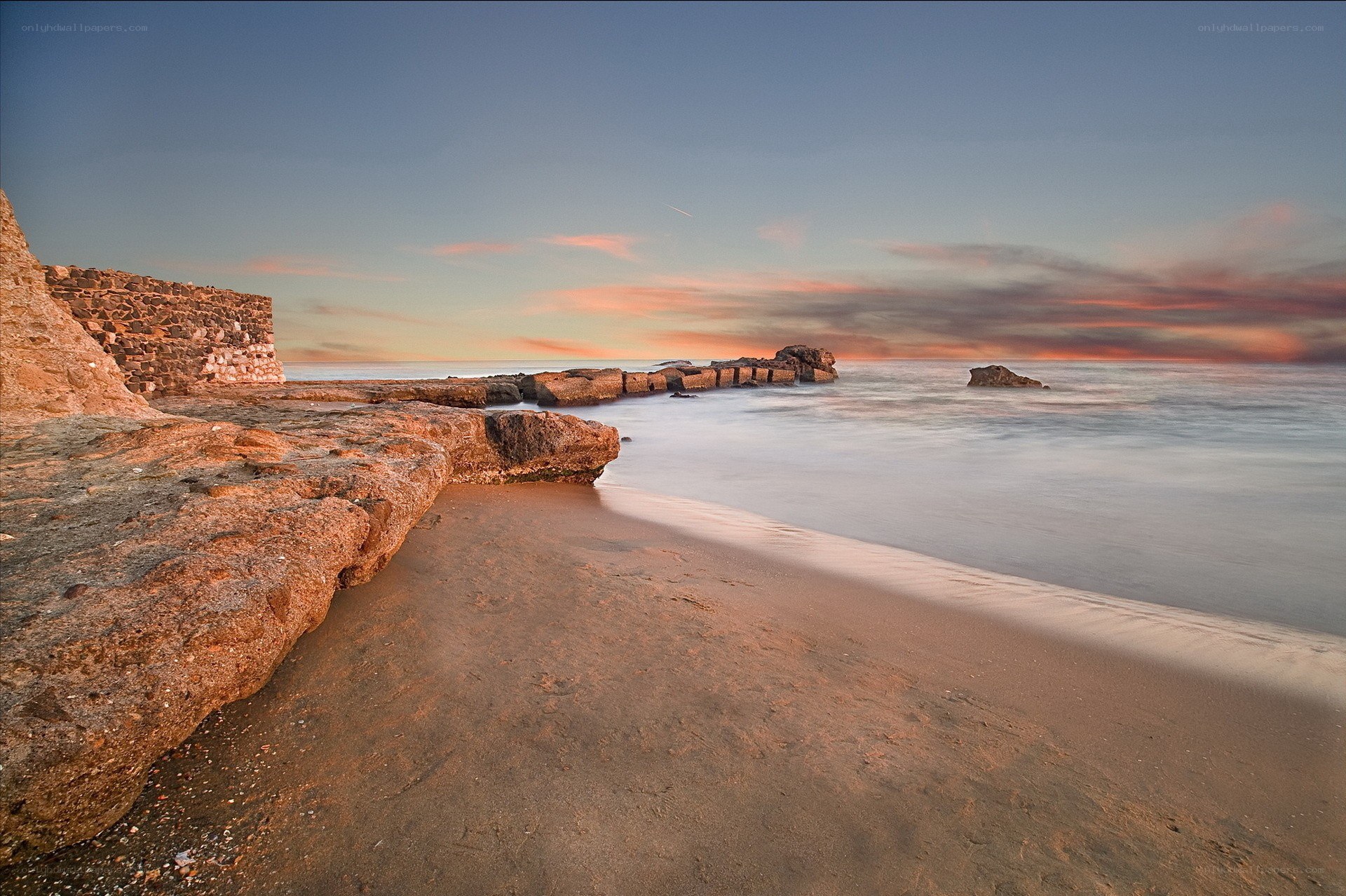 Sunset at the rocky beach
