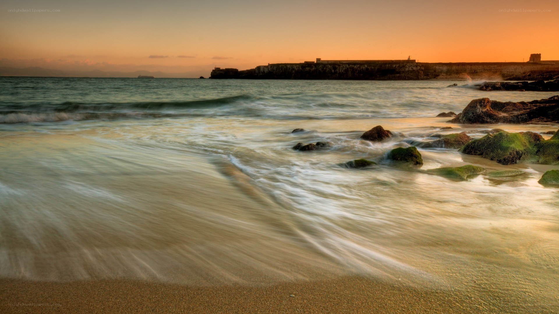 Sunset at the rocky shore