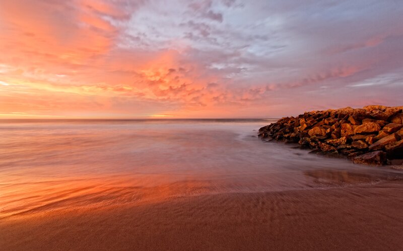 Sunset at the rocky shore