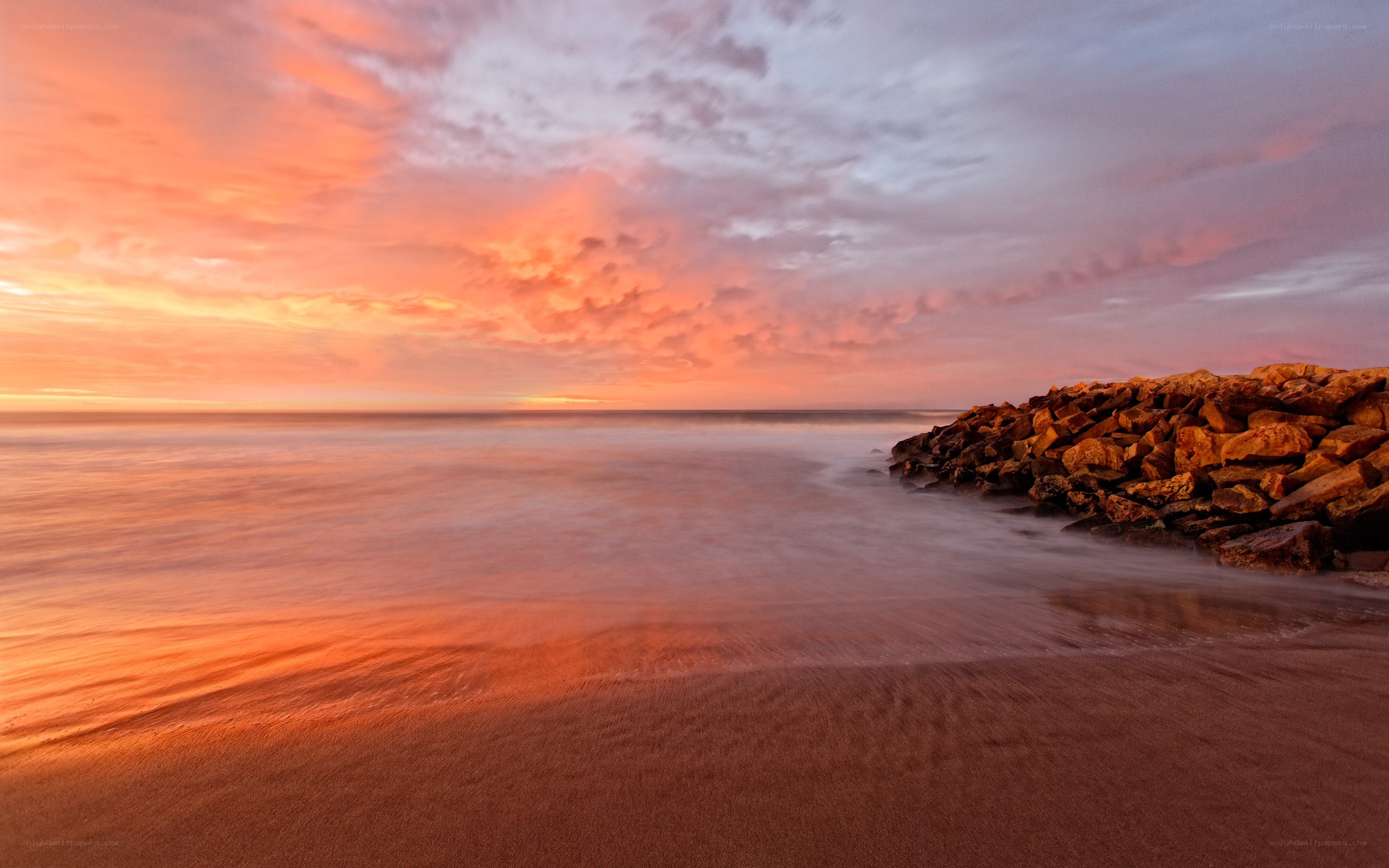 Sunset at the rocky shore