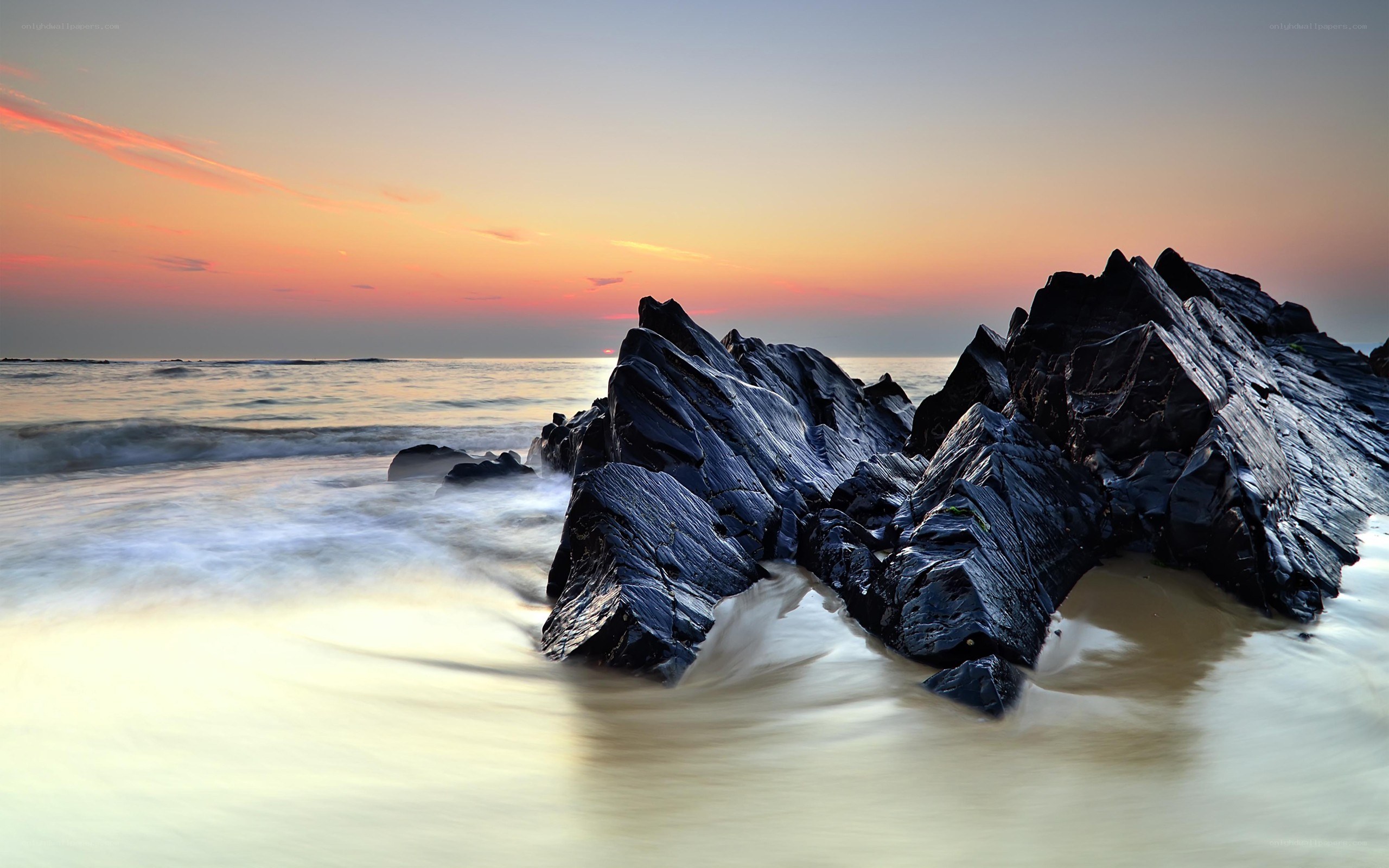 Sunset at the rocky shore