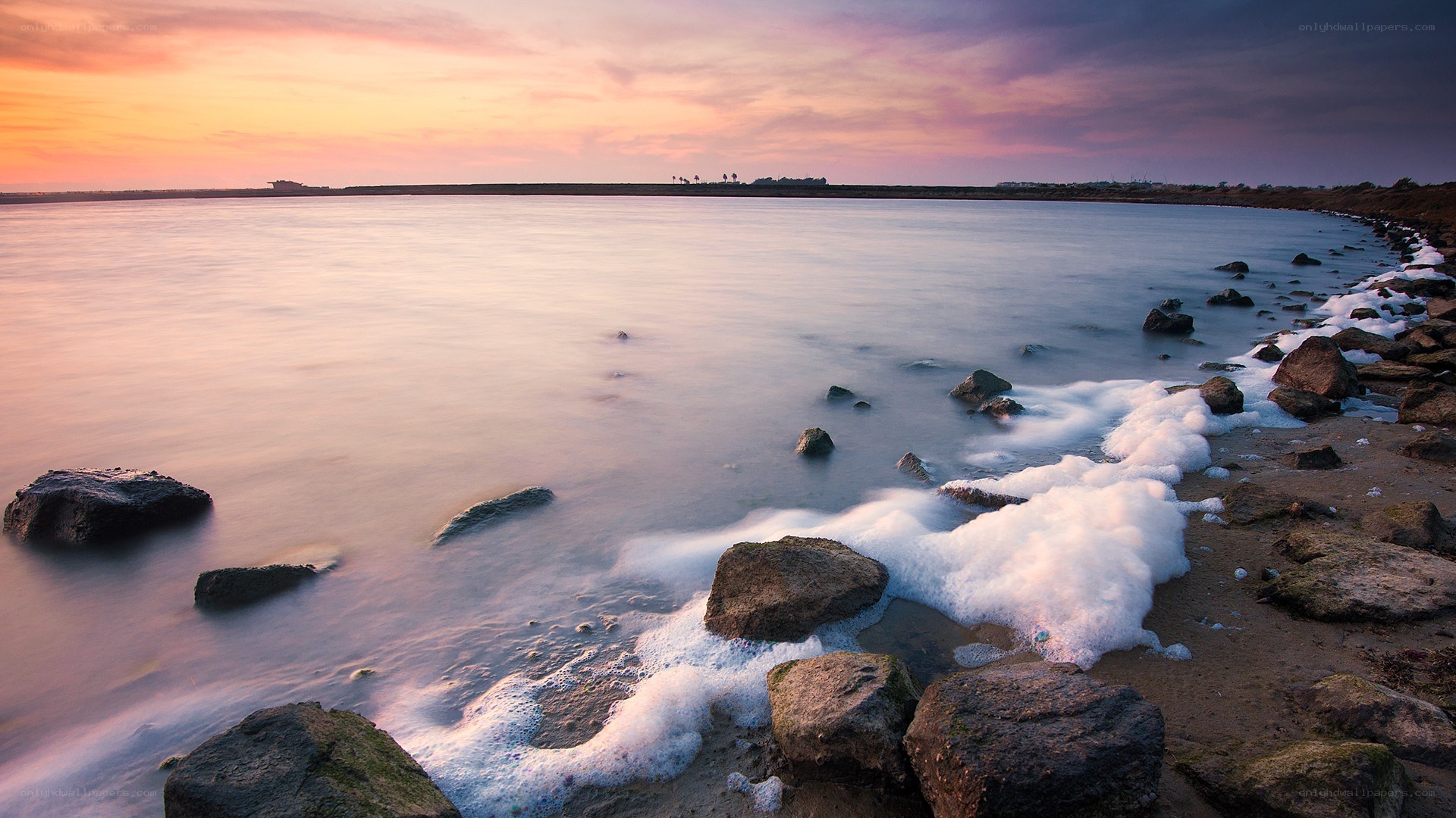 Sunset at the rocky shore