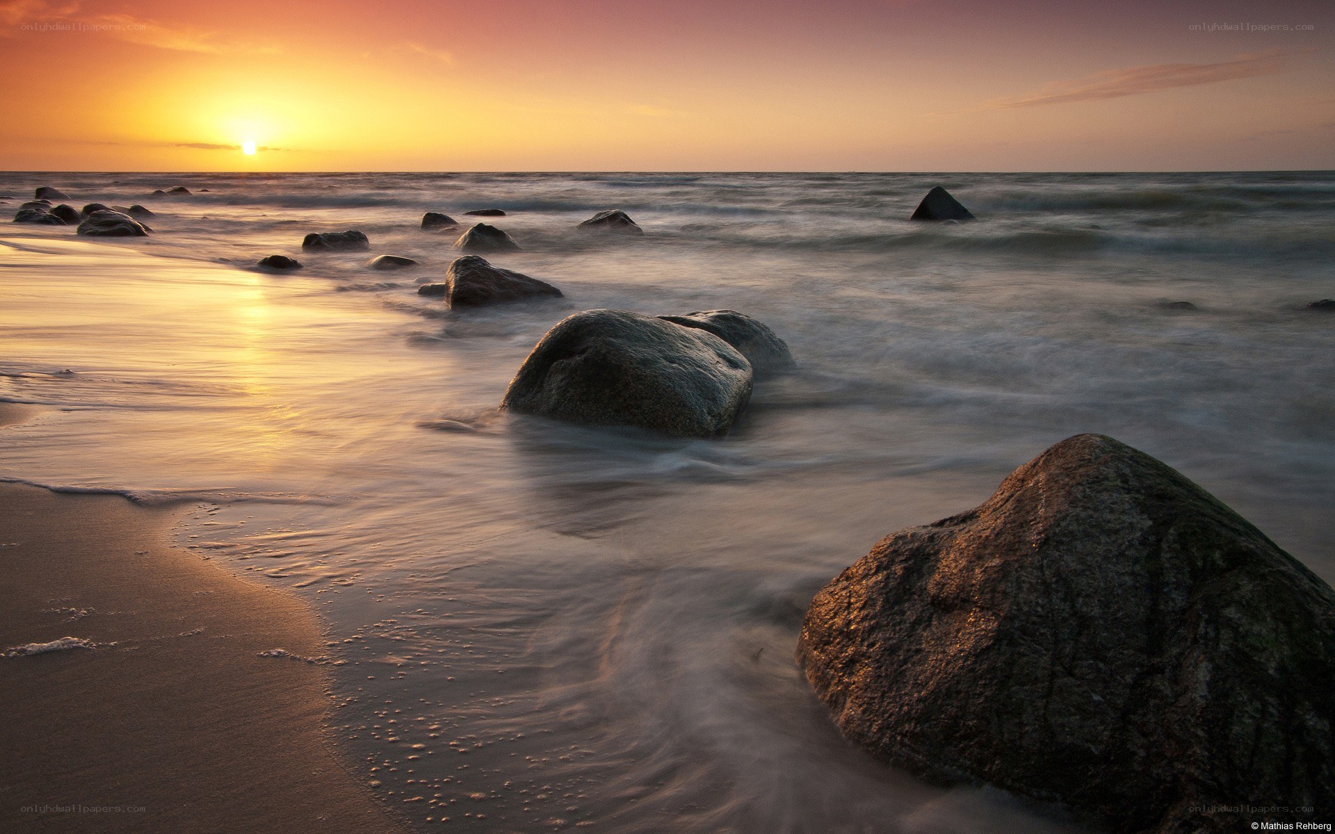 Sunset at the rocky shore
