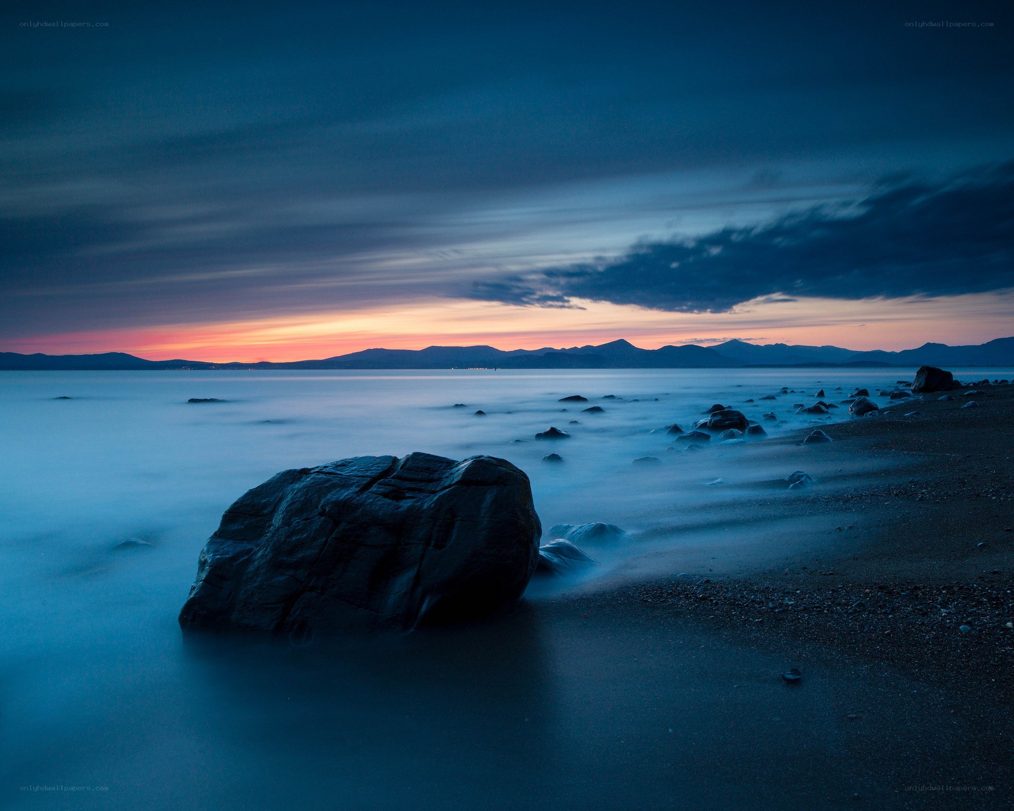 Sunset at the rocky shore