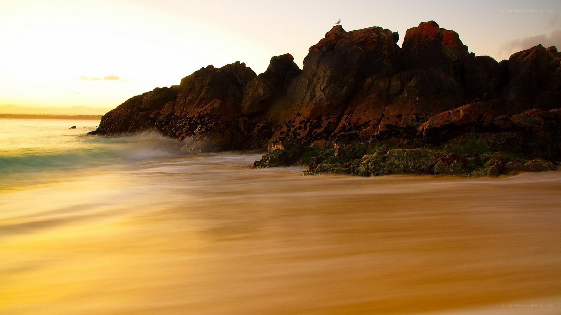 Sunset at the rocky shore