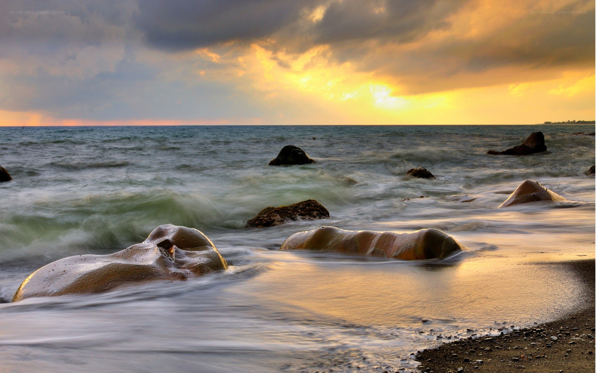 Sunset at the rocky shore