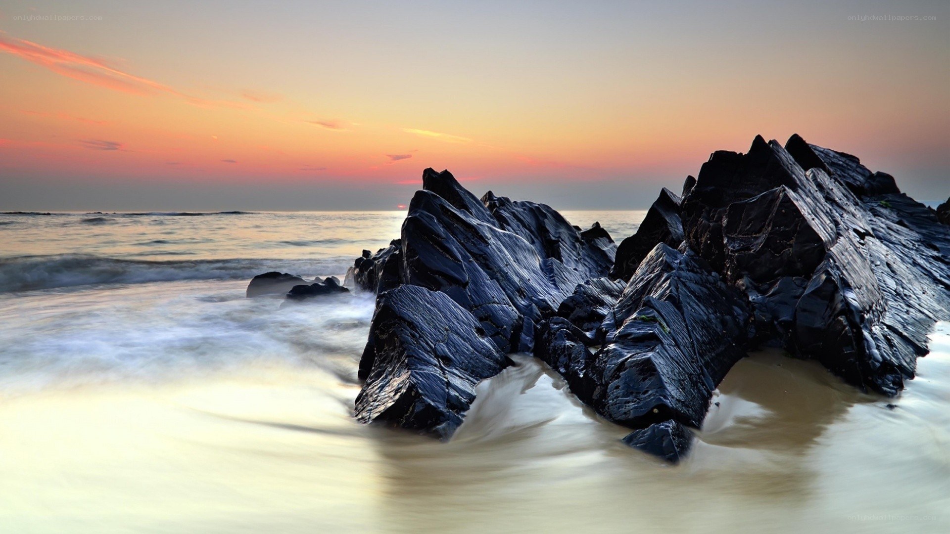 Sunset at the rocky shore