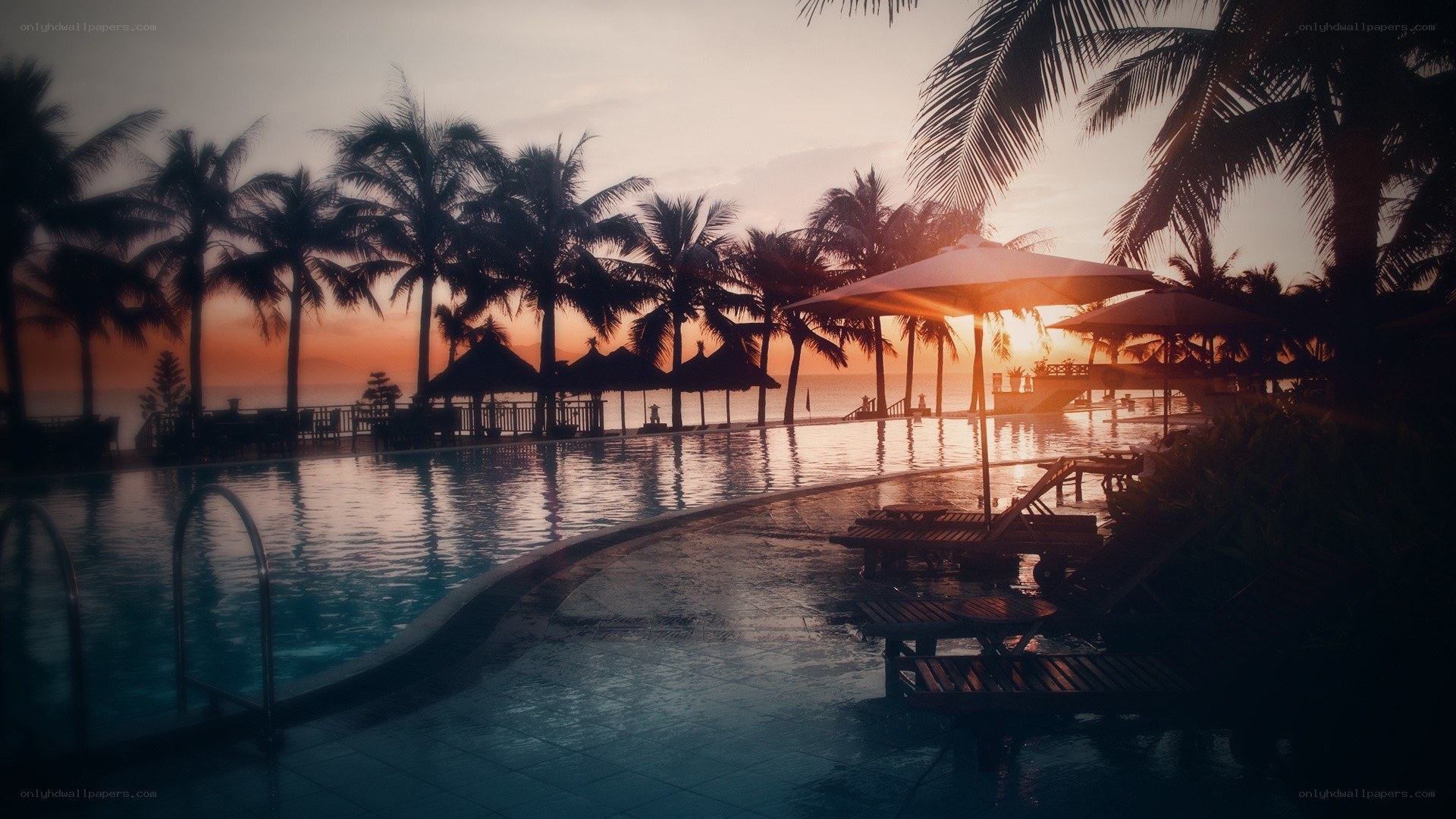 sunset at tropical resort pool