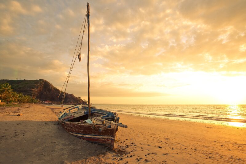 sunset beach boat scene