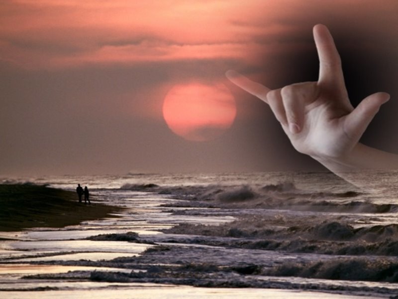 Sunset beach with hand gesture