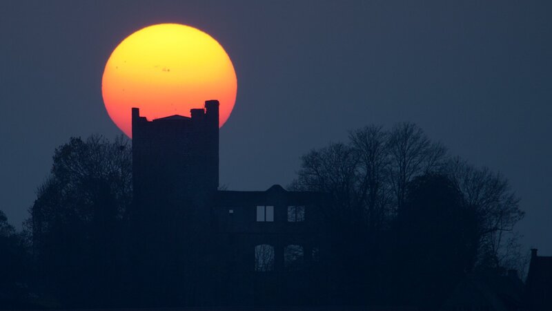 Sunset behind a castle silhouette